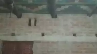 Village girl applying lotion to full nude body