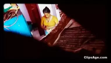 Desi maid changing dress captured using placed in room