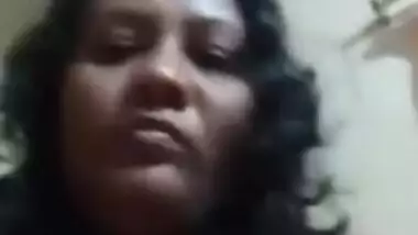 Desi mom with serious face sits before camera topless in solo sex clip