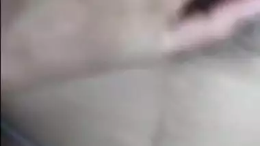 Desi girl nude on bed and fingering her hairy pussy