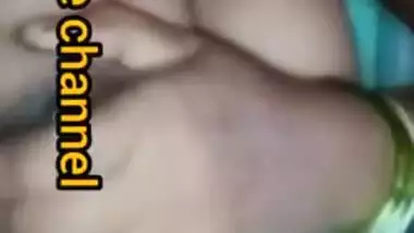 Naughty Desi woman squeezes tits to lick nipples in the porn video