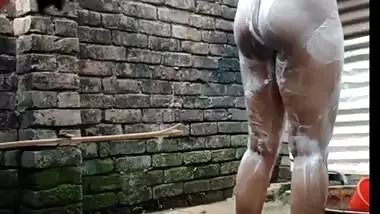 Indian village girl is bathing in the bathroom