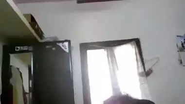 Sweet Desi teen whips out perfect XXX breasts and poses naked near bed